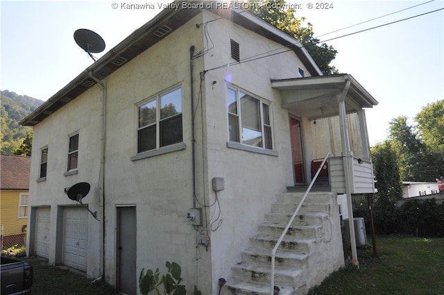 view of property exterior with a garage