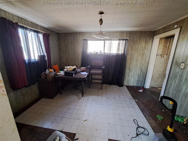 dining room featuring wooden walls