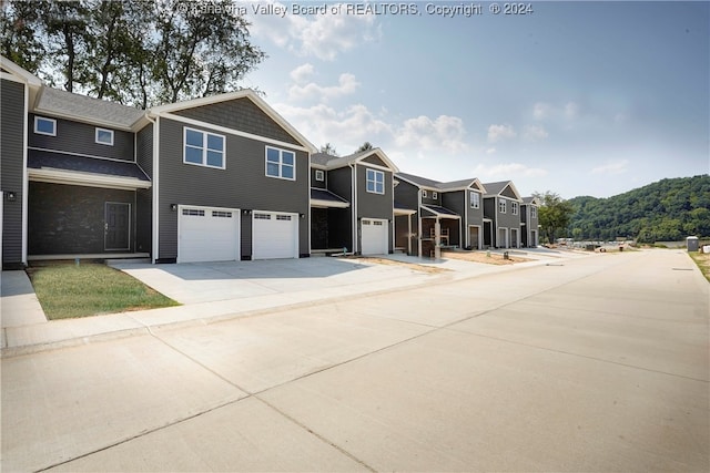 view of front of home featuring a garage and a mountain view