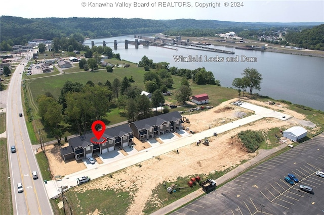 birds eye view of property with a water view