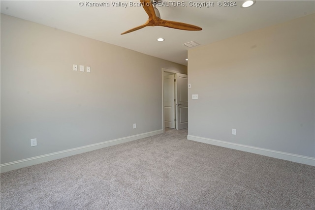 spare room featuring carpet floors