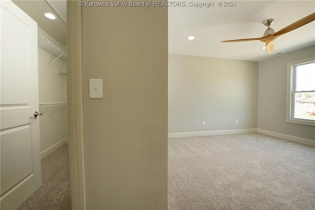 interior space with ceiling fan