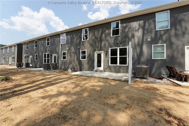 back of house with central AC unit and a patio area