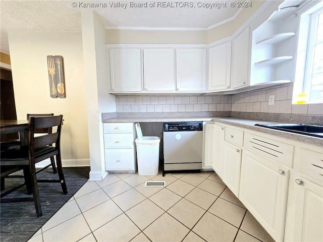 kitchen featuring stainless steel dishwasher, white cabinets, and decorative backsplash