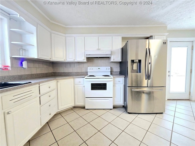 kitchen with white cabinetry, light tile patterned floors, backsplash, white electric range, and stainless steel fridge