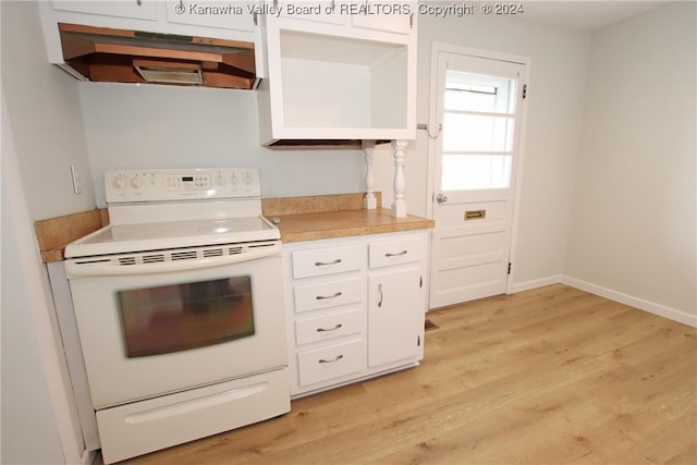 kitchen featuring white cabinetry, electric stove, and light hardwood / wood-style floors