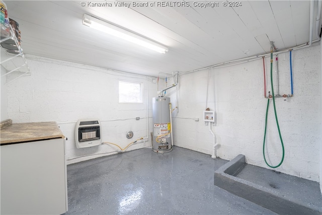 basement with gas water heater and heating unit