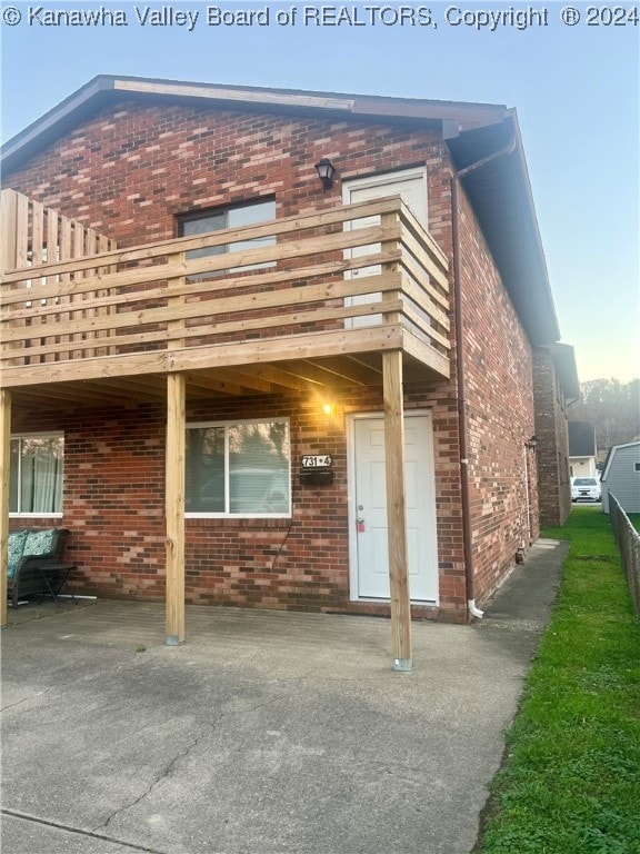 exterior space featuring a patio and a balcony