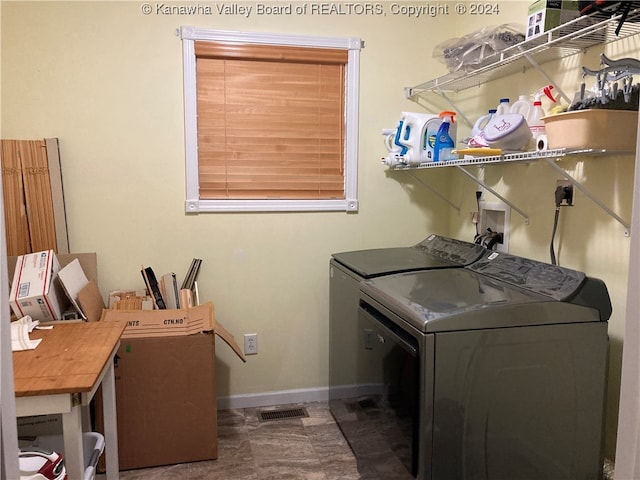 clothes washing area featuring washing machine and clothes dryer