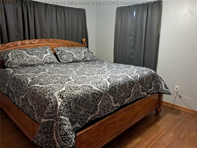 bedroom featuring hardwood / wood-style floors