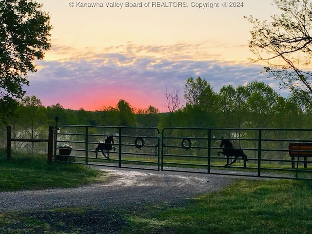 view of gate at dusk