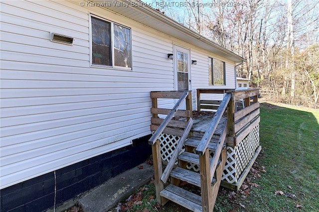 wooden terrace with a yard