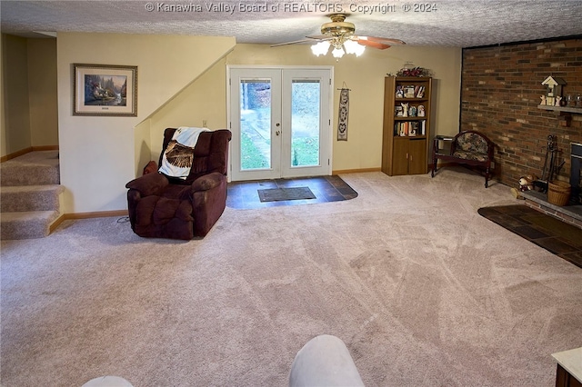 living room with light carpet, french doors, a textured ceiling, and ceiling fan