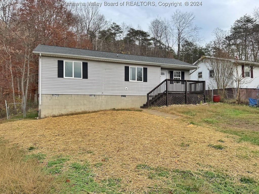 back of property featuring a wooden deck