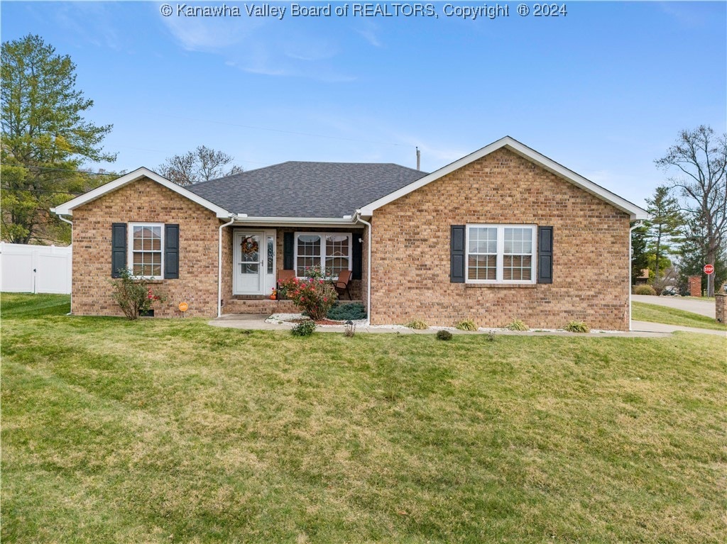 ranch-style house with a front lawn