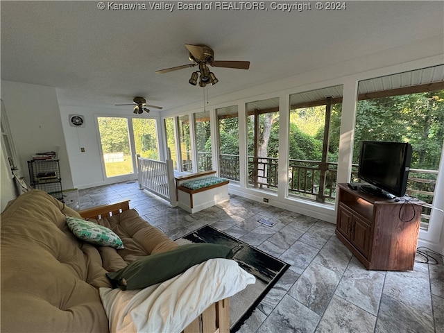 sunroom / solarium with ceiling fan