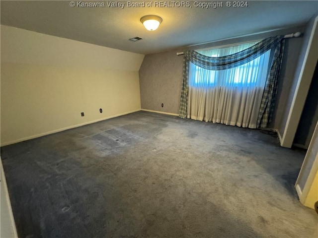103 Central Ave, Logan, WV 25601 - carpeted spare room with lofted ceiling and baseboards
