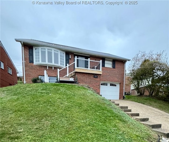 view of front of home with a garage and a front lawn