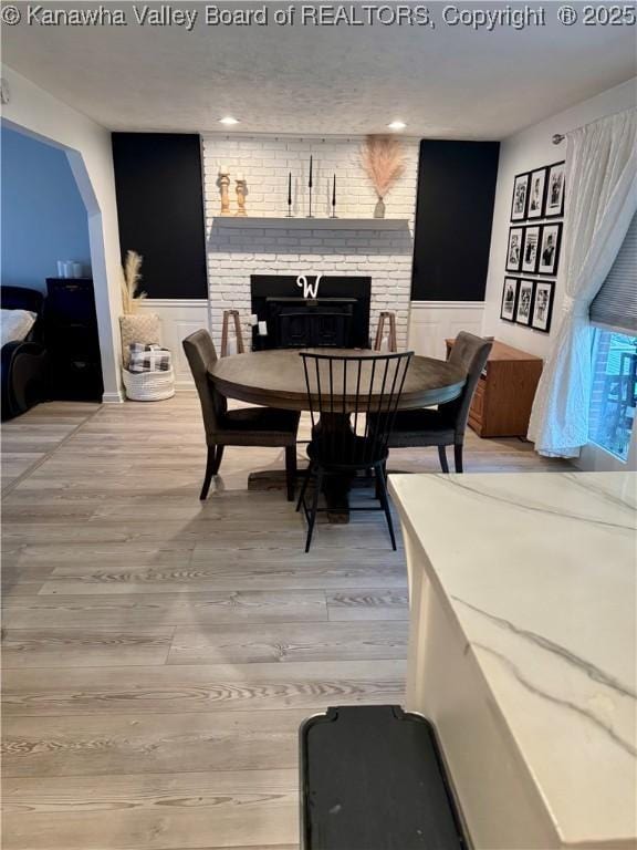 dining space with wood-type flooring