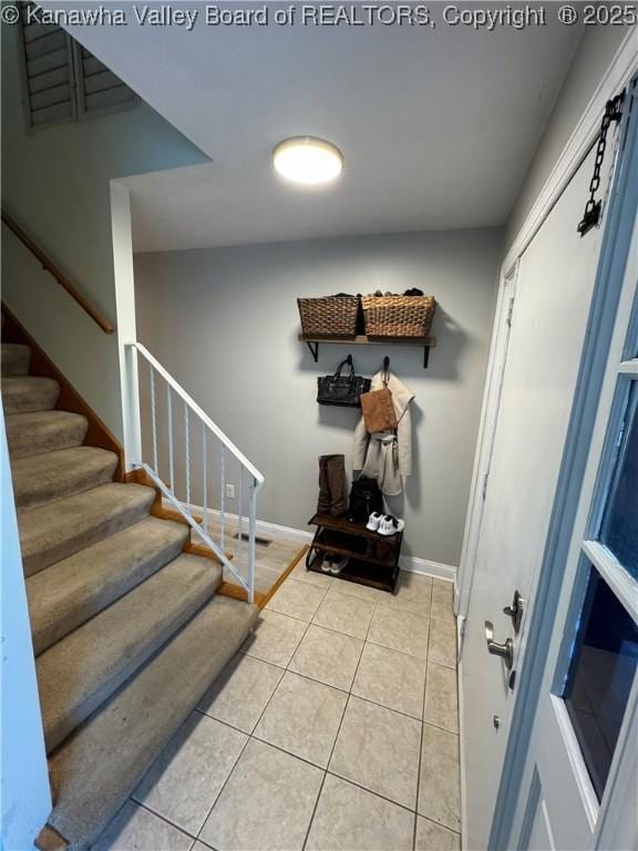 entrance foyer featuring light tile patterned floors