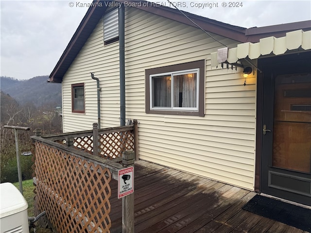 wooden deck with a mountain view