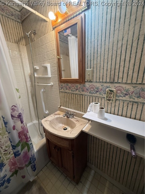 bathroom with vanity and shower / tub combo with curtain