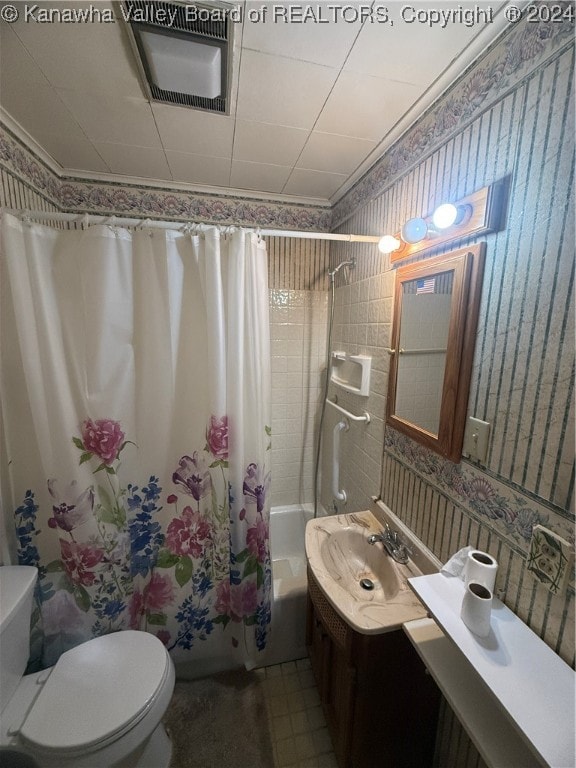 full bathroom featuring vanity, shower / bathtub combination with curtain, and toilet