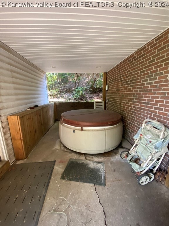 view of patio with a hot tub