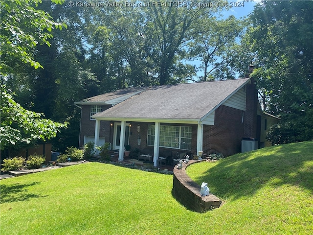 exterior space featuring a porch and a yard