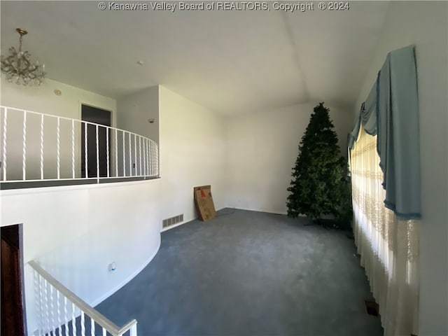 interior space featuring dark colored carpet