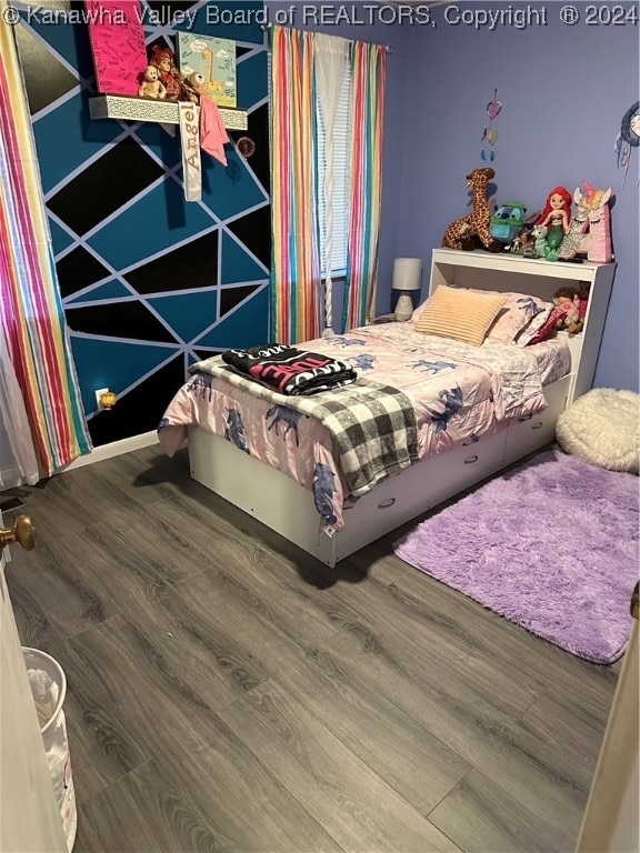 bedroom featuring hardwood / wood-style floors