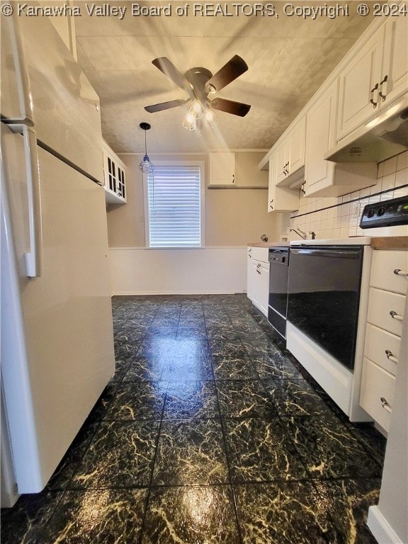 kitchen featuring ceiling fan, hanging light fixtures, white appliances, decorative backsplash, and white cabinets