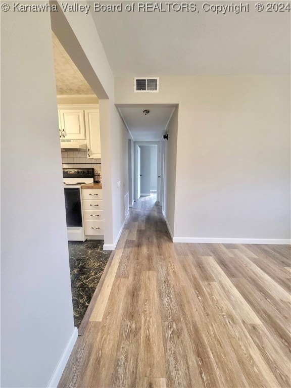 hallway featuring hardwood / wood-style flooring