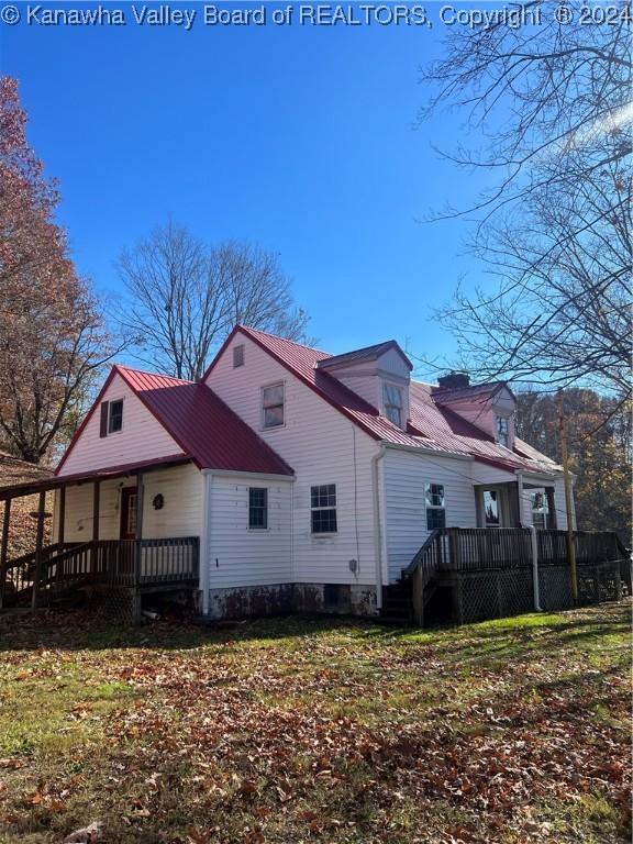 view of home's exterior with a lawn