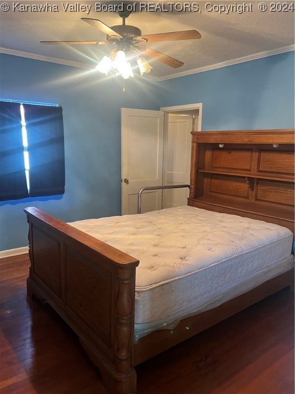 bedroom featuring crown molding, ceiling fan, and dark wood-type flooring