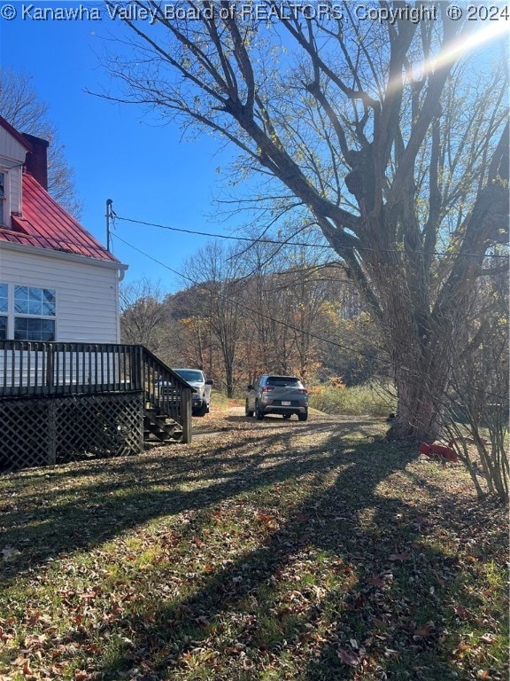 view of yard with a wooden deck