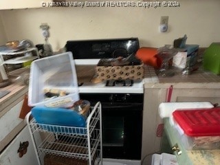 kitchen with white range with gas stovetop