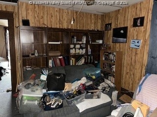 miscellaneous room featuring wooden walls