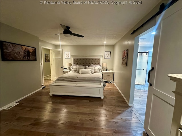 bedroom featuring ceiling fan and dark wood-type flooring