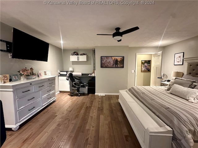 bedroom with ceiling fan and dark wood-type flooring