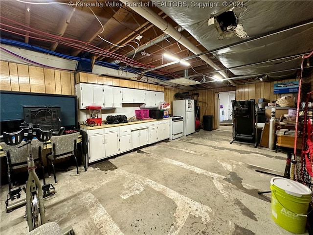 basement with white fridge