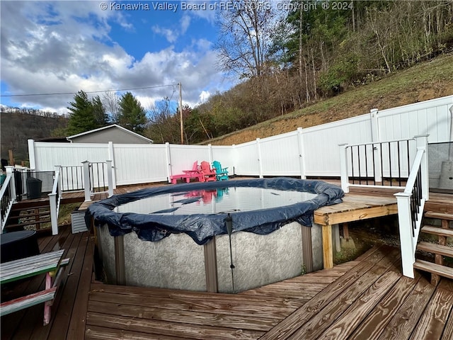 deck with a covered pool