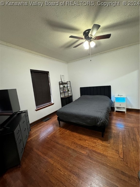 bedroom featuring a textured ceiling, ceiling fan, ornamental molding, and dark wood-type flooring