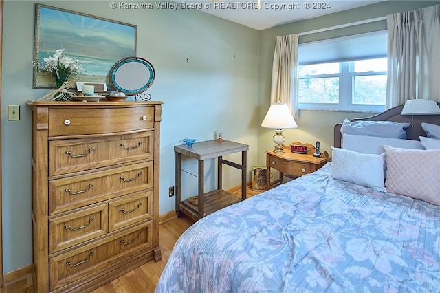 bedroom with light wood-type flooring