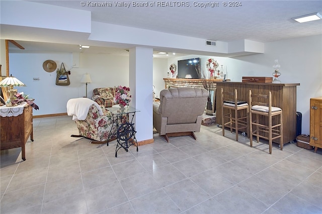 tiled living room with bar