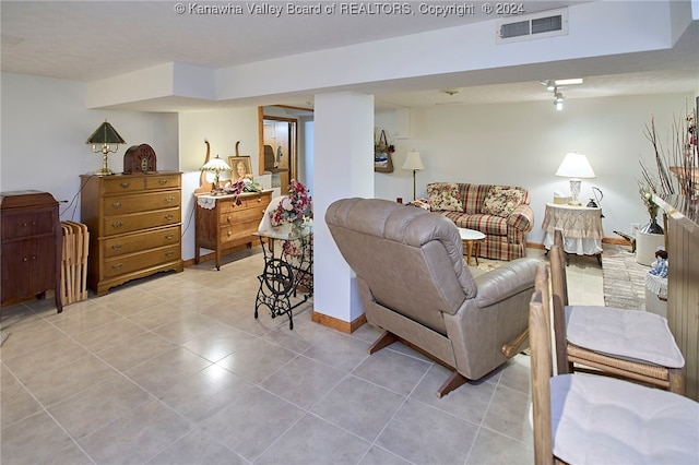 living room with light tile patterned floors