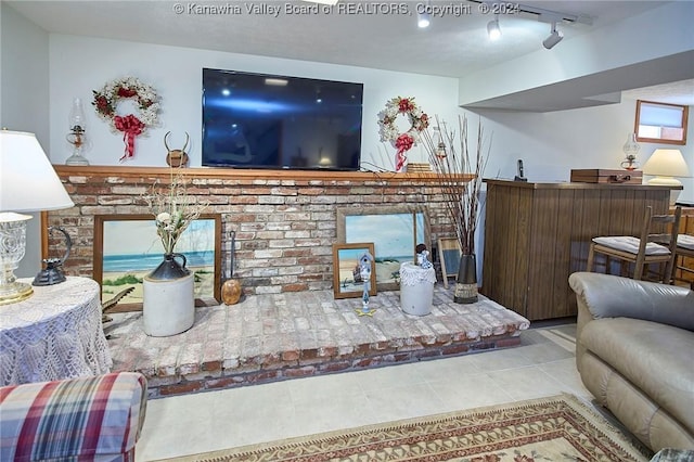 living room with light tile patterned flooring and rail lighting