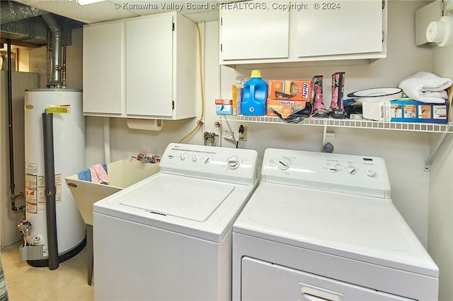 laundry room featuring water heater, separate washer and dryer, light tile patterned floors, and cabinets