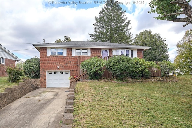 view of front of home with a garage and a front lawn