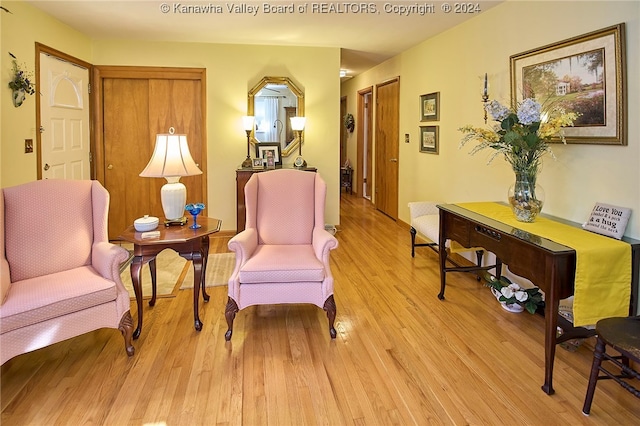 sitting room featuring light hardwood / wood-style flooring